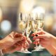 Celebration. People holding glasses of champagne making a toast. Champagne with blurred background